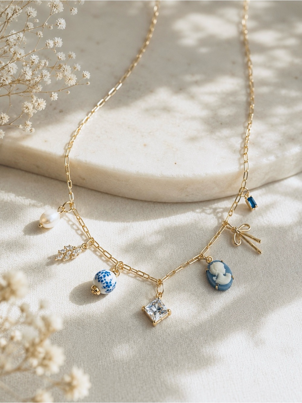 Gold Charm Necklace with Blue Cameo and Pearl Accents